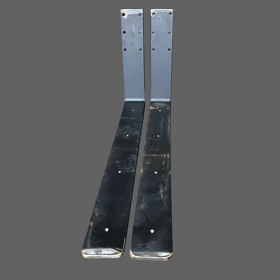 Drilled and reamed holes in 52" forklift forks
